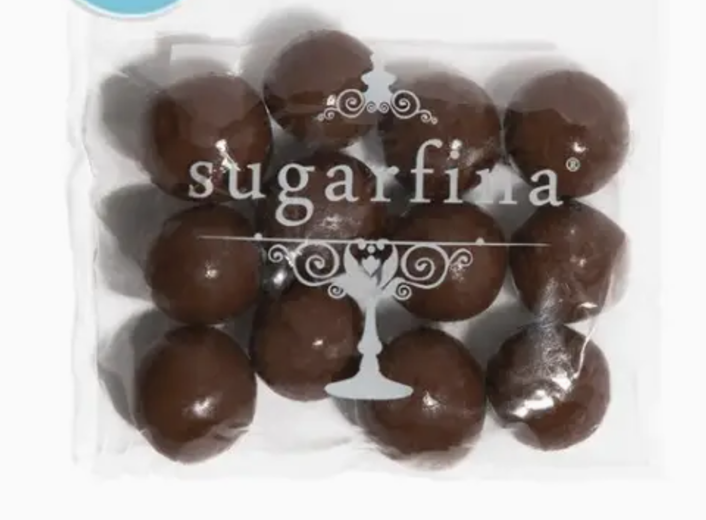 Packaged chocolate truffles with 'sugarfina' branding on a white background
