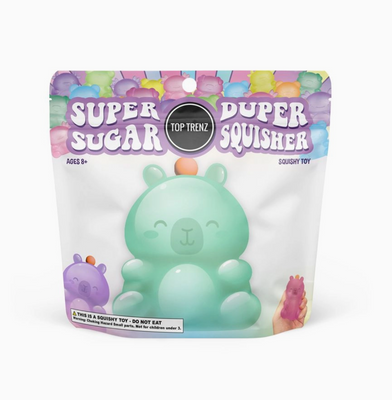Packaging of a squishy toy with a green character on a white background