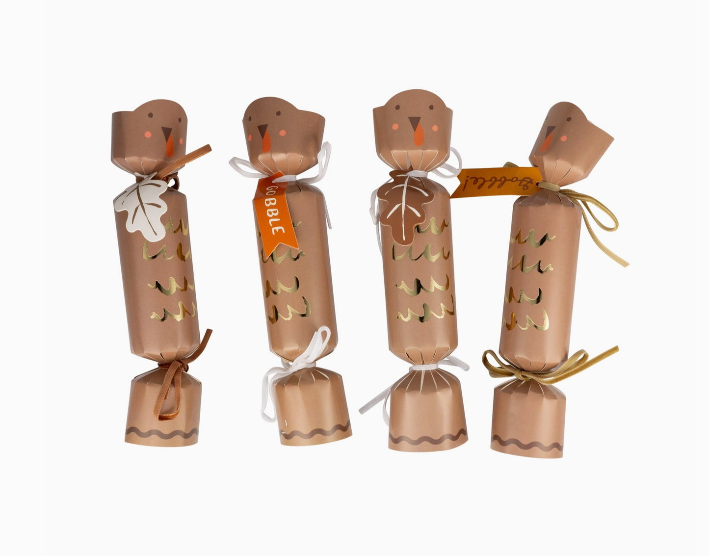 Four brown paper cracker decorations with festive designs on a white background