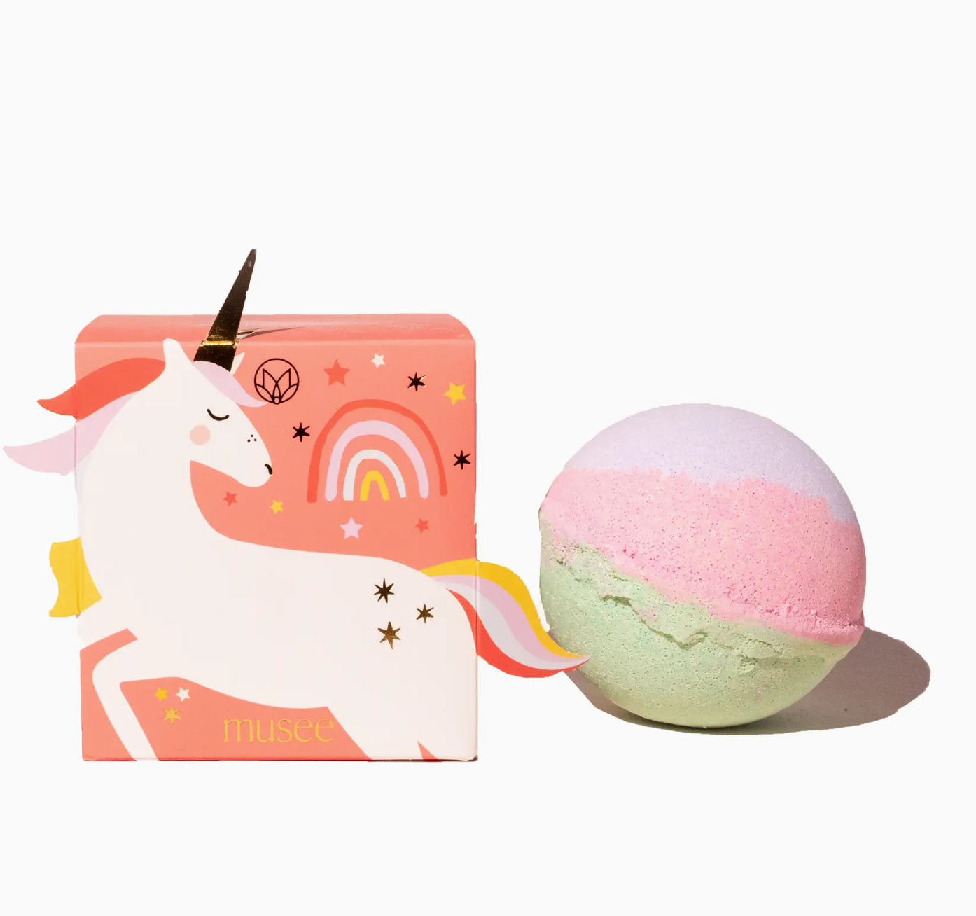 Unicorn-themed bath bomb with colorful packaging on a white background