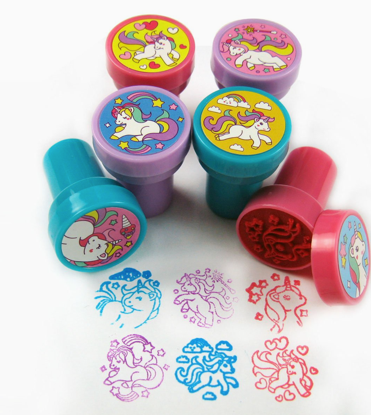 Set of colorful unicorn-themed stamps with stamp impressions on a white background