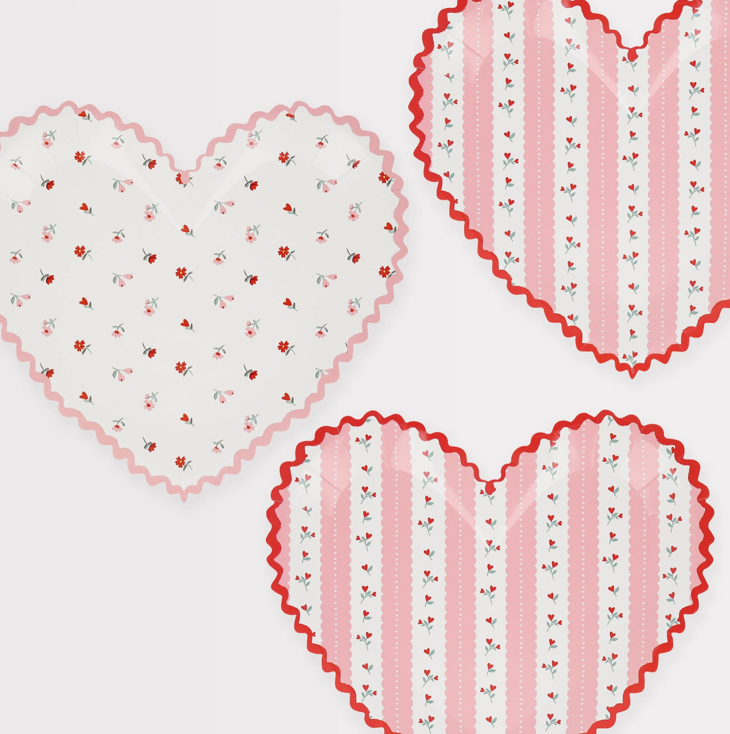 Heart-shaped doilies with floral and striped patterns on a white background