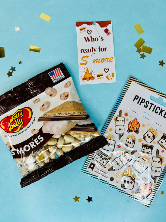 Jelly Belly S'mores candy package with 'Who's ready for S'more' and 'Pipsticks' stickers on a blue background.