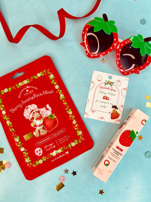 Berry-themed face mask packaging with strawberry design on a light blue background