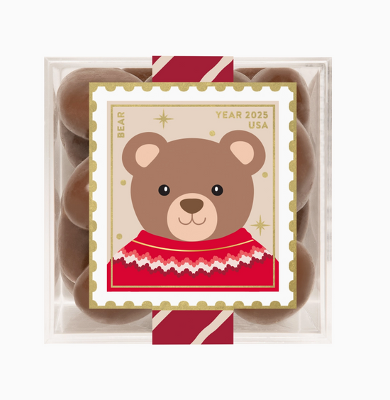 Packaged chocolate bears with a bear illustration on a white background