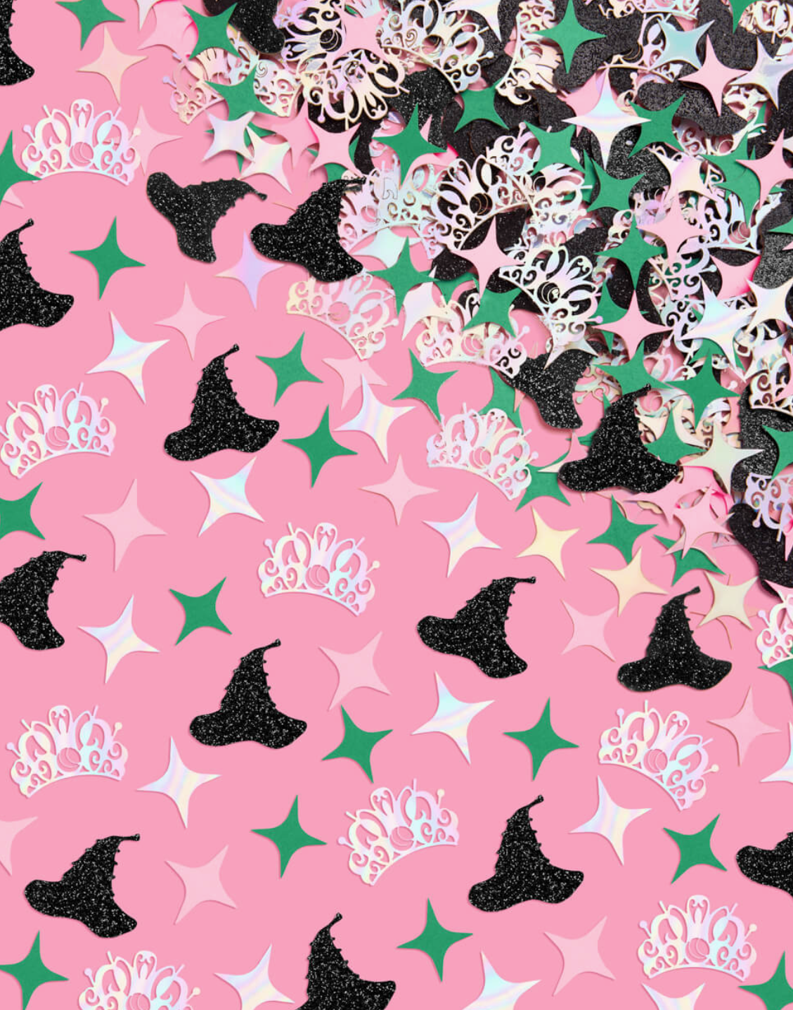 Pattern of witch hats, crowns, and stars on a pink background