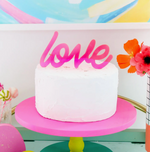 Neon pink Love script cake topper